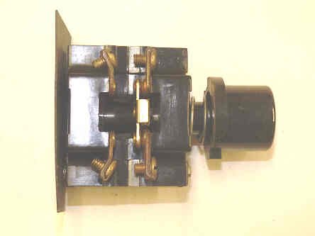 BUTTON, BLACK, BLANK, USED ON EARLY SERGE HALL STATIONS MARKING A100-44061A