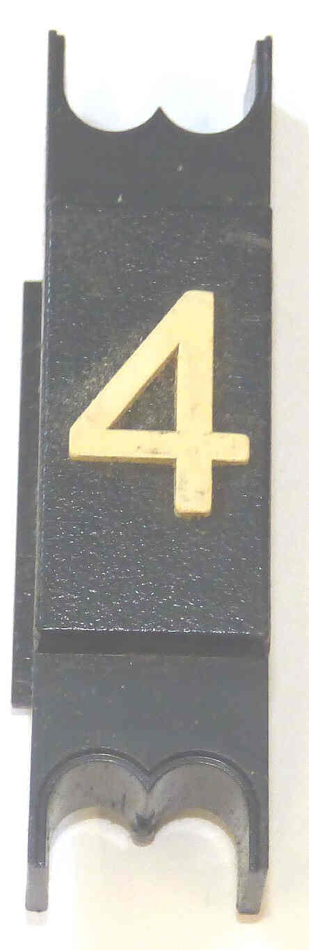 SPACER, .625 WIDE, BLACK, WITH BRAILLE, MARKED # 5 DOVER # 9893714