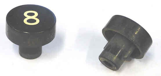 BUTTON, BLACK, MARKED # 8, 1 DIAMETER OTIS # 323BD1-8