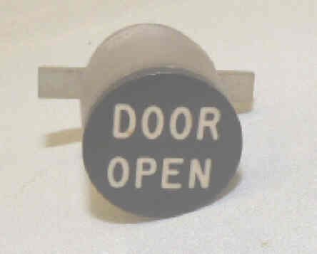 BUTTON, BLACK, ENGRAVED DOOR OPEN DOVER # 9852529