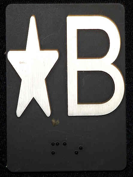 PLATE, BRAILLE, HALL, 3.5 X 2.5 SELF ADHESIVE MARKED ' * B'