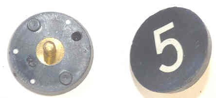 BUTTON, 7/8, BLACK, HOT STAMPED IN WHITE, MARKED 5 OTIS # 323BL2