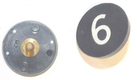 BUTTON, 7/8, BLACK, HOT STAMPED IN WHITE, MARKED 6 OTIS # 323BL2