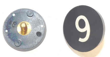 BUTTON, 7/8, BLACK, HOT STAMPED IN WHITE, MARKED 6 OTIS # 323BL2
