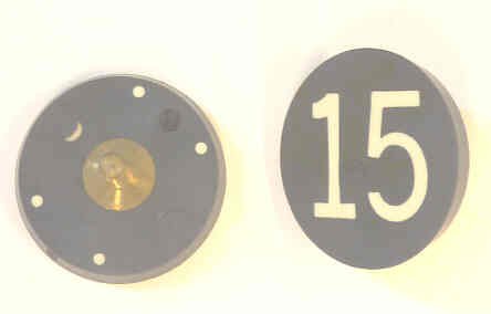 BUTTON, 7/8, BLACK, HOT STAMPED IN WHITE, MARKED 15 OTIS # 323BL2