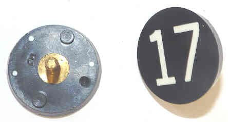 BUTTON, 7/8, BLACK, HOT STAMPED IN WHITE, MARKED 17 OTIS # 323BL2