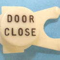 BUTTON, WHITE, ENGRAVED, BLACK DOOR CLOSE DOVER # 106734