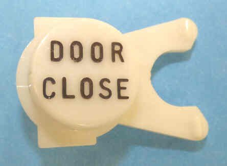 BUTTON, WHITE, ENGRAVED, BLACK DOOR CLOSE DOVER # 106734