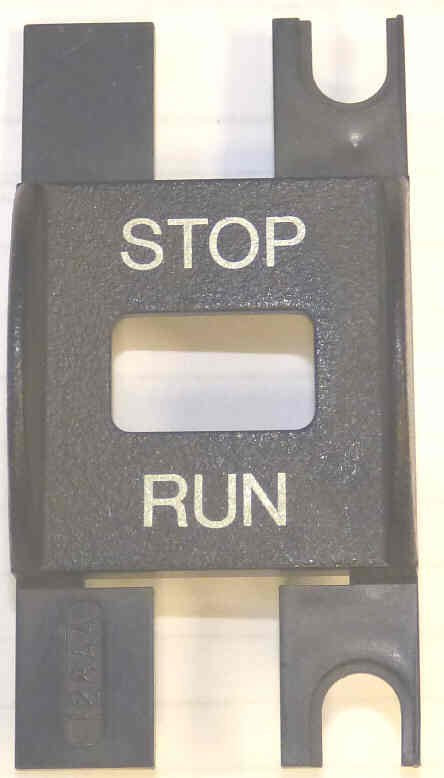 BEZEL, SWITCH, STOP, SLIDING, MARKED STOP/RUN U/W DOVER # 9810158