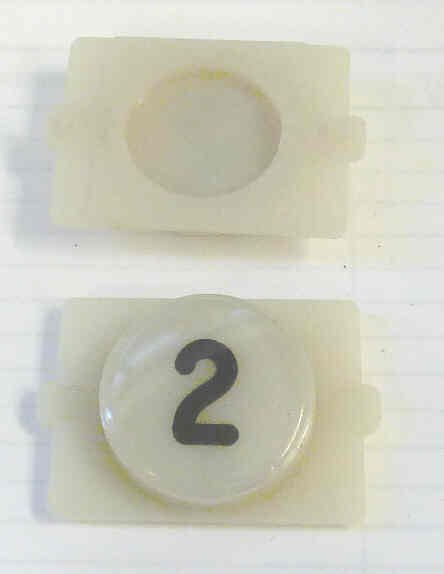 BUTTON, E LINE, WAFER, CLEAR CAP, MARKED 2 IN BLACK WESTINGHOUSE # 323C855H02