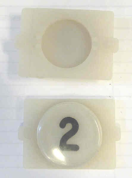 BUTTON, E LINE, WAFER, CLEAR CAP, MARKED 2 IN BLACK WESTINGHOUSE # 323C855H02