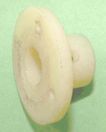 BUSHING, PLASTIC, MACHINED AND DRILLED, AS SHOWN PEELLE # 093424