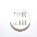 INSERT, BUTTON, 7/8 DIA., WHITE, MARKED DOOR CLOSE IN BLACK ARMOR # 11133-01