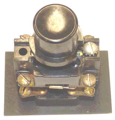 BUTTON, BLACK, BLANK, USED ON EARLY SERGE HALL STATIONS MARKING A100-44061A