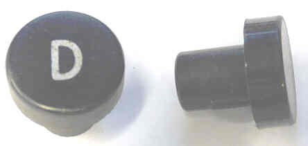BUTTON, 7/8 DIAMETER, HOT STAMPED, MARKED 'D' OTIS # A323AF1-DOWN