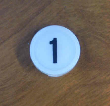 INSERT, BUTTON, 7/8 DIA., WHITE, MARKED # 1 IN BLACK ARMOR # 11133-01