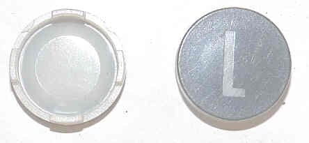 INSERT, BUTTON, 7/8 DIA., BLACK, MARKED 'L' IN WHITE  ARMOR # 11134-01