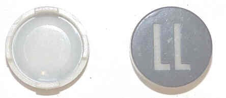 INSERT, BUTTON, 7/8 DIA., BLACK, MARKED 'LL' IN WHITE  ARMOR # 11134-01
