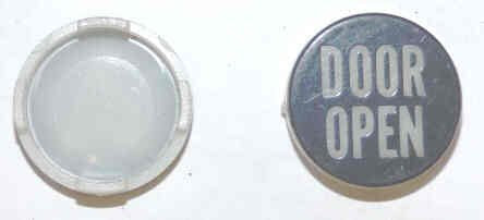 INSERT, BUTTON, 7/8 DIA., BLACK, MARKED 'DOOR OPEN' IN WHITE  ARMOR # 11134-01