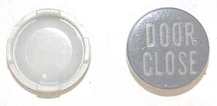 INSERT, BUTTON, 7/8 DIA. BLACK, MARKED 'DOOR CLOSE' IN WHITE  ARMOR # 11134-01