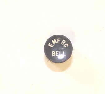 BUTTON, BLACK, TYPE 'E', MARKED 'EMER BELL' HAUGHTON # 3-19353-EB