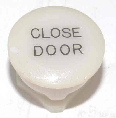BUTTON, WHITE, MARKED DOOR CLOSE TYPE 'F' HAUGHTON # 3-19512-__