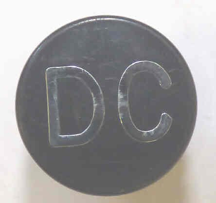 BUTTON, 7/8 DIAMETER, HOT STAMPED, MARKED DC A323AF1-DC