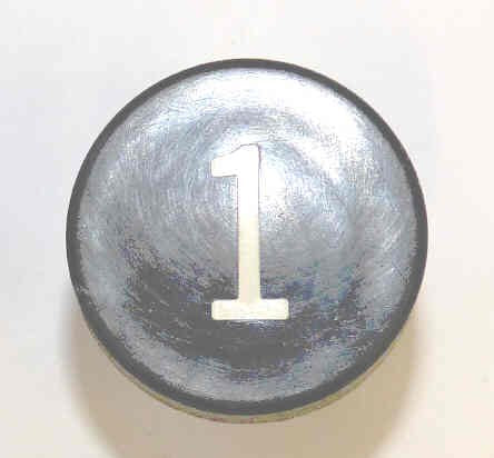 BUTTON, BLACK, MARKED # 1, 1 DIAMETER OTIS # 323BD1-1