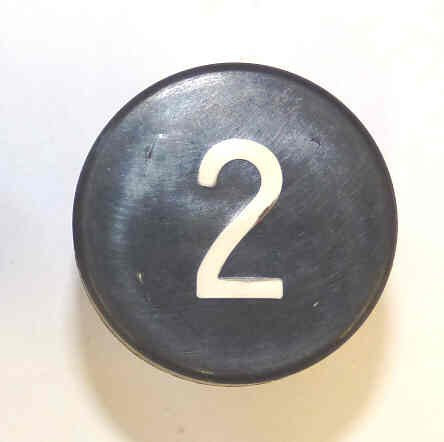 BUTTON, BLACK, MARKED # 2, 1 DIAMETER OTIS # 323BD1-2