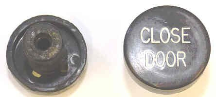 BUTTON, BLACK, MARKED DOOR CLOSE, 1 DIAMETER OTIS # 323BD1-DC