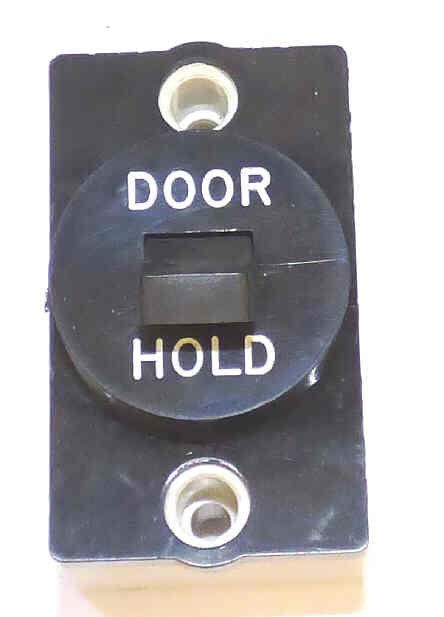 SWITCH, BLACK BEZEL, TOGGLE, ENGRAVED DOOR HOLD GAL # PB6-0013V