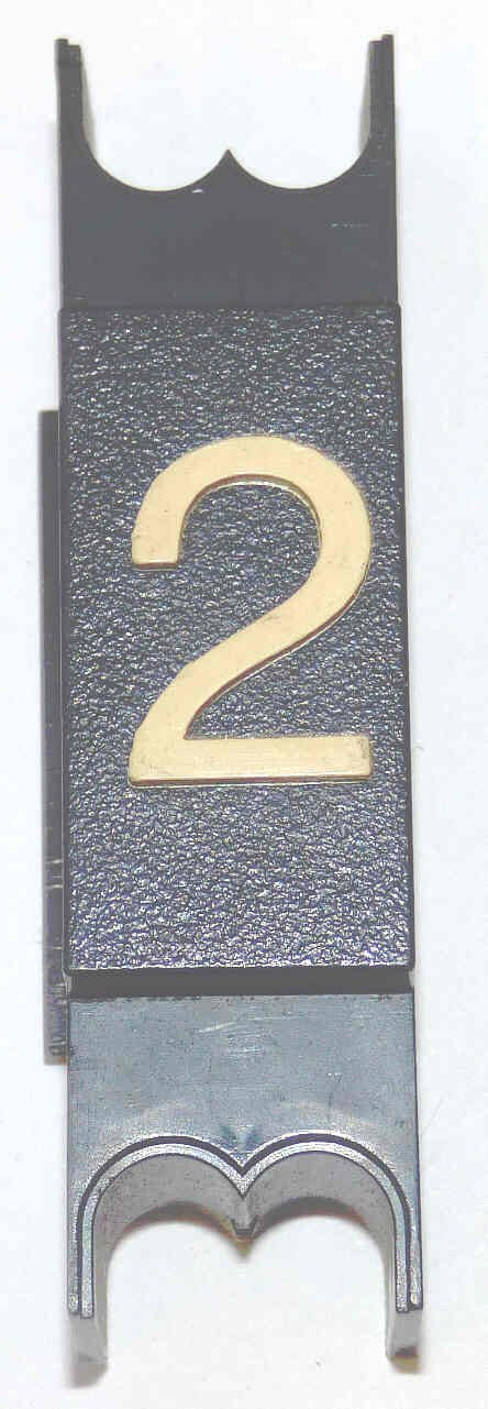 SPACER, .625  WIDE, BLACK, WHITE MARKING, MARKED # 2 DOVER # 9893696
