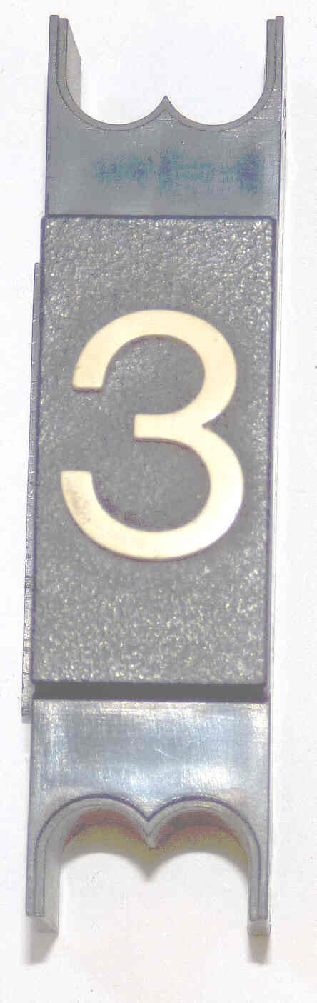 SPACER, .625  WIDE, BLACK, WHITE MARKING, MARKED # 3 DOVER # 9893702