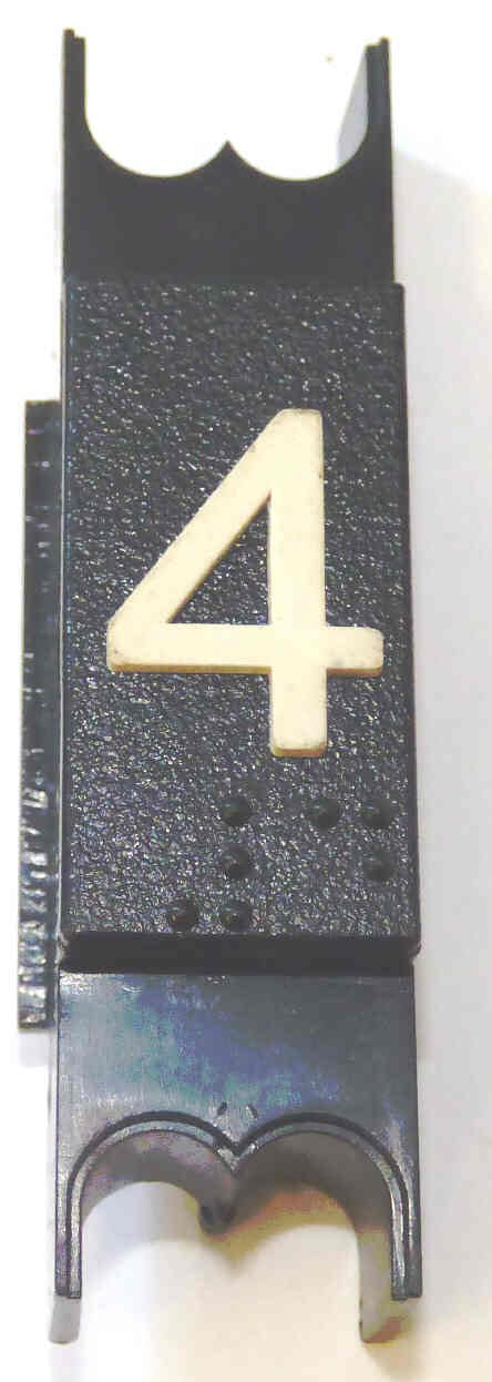 SPACER, .625  WIDE, BLACK, WITH BRAILLE, MARKED # 4 DOVER # 9893714
