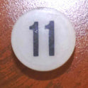 INSERT, BUTTON, 7/8 DIA., WHITE, MARKED # 11 IN BLACK ARMOR # 11133-01