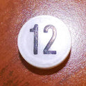 INSERT, BUTTON, 7/8 DIA., WHITE, MARKED # 12 IN BLACK ARMOR # 11133-01