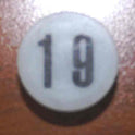 INSERT, BUTTON, 7/8 DIA., WHITE, MARKED # 19 IN BLACK ARMOR # 11133-01