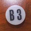 INSERT, BUTTON, 7/8 DIA., WHITE, MARKED B3 IN BLACK ARMOR # 11133-01