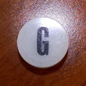 INSERT, BUTTON, 7/8 DIA., WHITE, MARKED G IN BLACK ARMOR # 11133-01