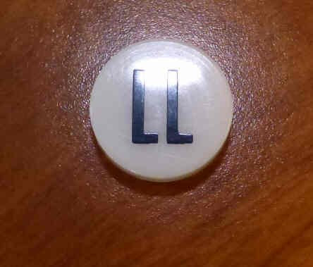 INSERT, BUTTON, 7/8 DIA., WHITE, MARKED LL IN BLACK ARMOR # 11133-01