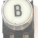 BUTTON, TOP, WHITE WITH BLACK VERTICAL B ARMOR # B761007