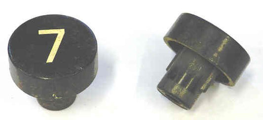 BUTTON, BLACK, MARKED # 7, 1 DIAMETER OTIS # 323BD1-7