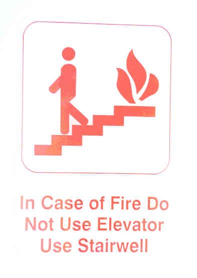 SIGN, FIRE, WITH EVACUATION INSTRUCTIONS, PLASTIC, SELF ADHESIVE, 6 X 9 RED
