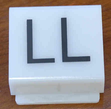 INSERT, POSITION INDICATOR, MARKED LL, 1 5/8 X 1 3/8 DOVER SERIES 9724400