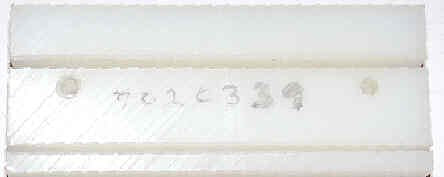 GUIDE, TAPE, MACHINED PLASTIC, USED ON STS-1 LEVELING UNITS