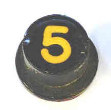 BUTTON, BLANK, BLACK, 3/4 X 7/16 TOP, 1 X 1/8 FLAT BASE, CENTER KEYHOLE