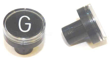 BUTTON, CLEAR CAP, 1 DIAMETER, MARKED 'G' OTIS # A323BD1-G