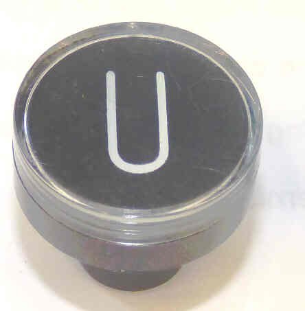 BUTTON, CLEAR CAP, 1 DIAMETER, MARKED 'U' OTIS # A323BD1-U