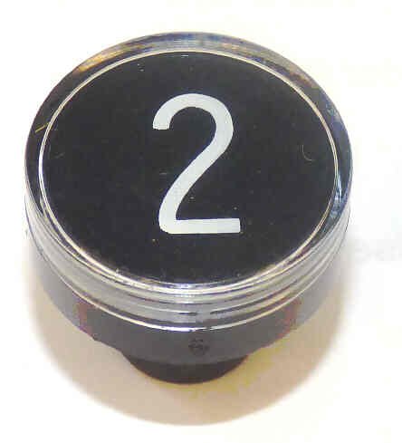 BUTTON, CLEAR CAP, 1 DIAMETER, MARKED #2 OTIS # A323BD1-2