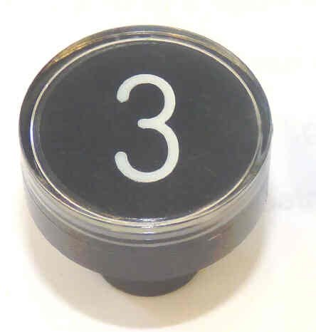 BUTTON, CLEAR CAP, 1 DIAMETER, MARKED #3 OTIS # A323BD1-3